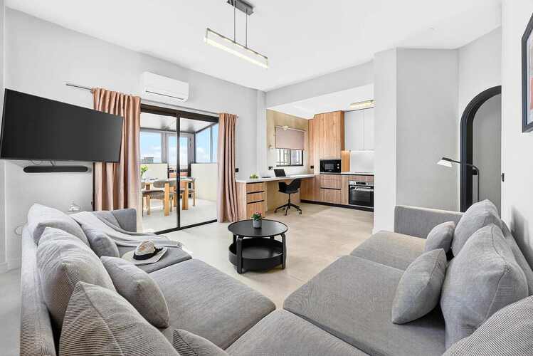 Spacious Living Area with Ocean View, AC, Multimedia TV & Sonos Sound System, Dedicated Working Space & Direct Exit to the Private Roof-Top Terrace