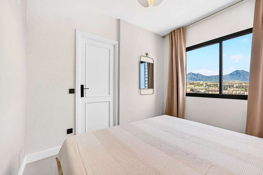 Peaceful Bedroom with Mountain Views & Soft Natural Light - Perfect for Restful Holiday Nights
