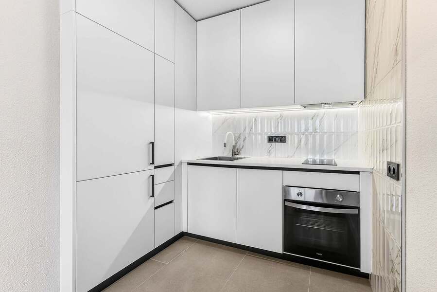 Sleek Minimalist Kitchen and Modern Appliances – Ideal for Effortless Home-Cooked Meals
