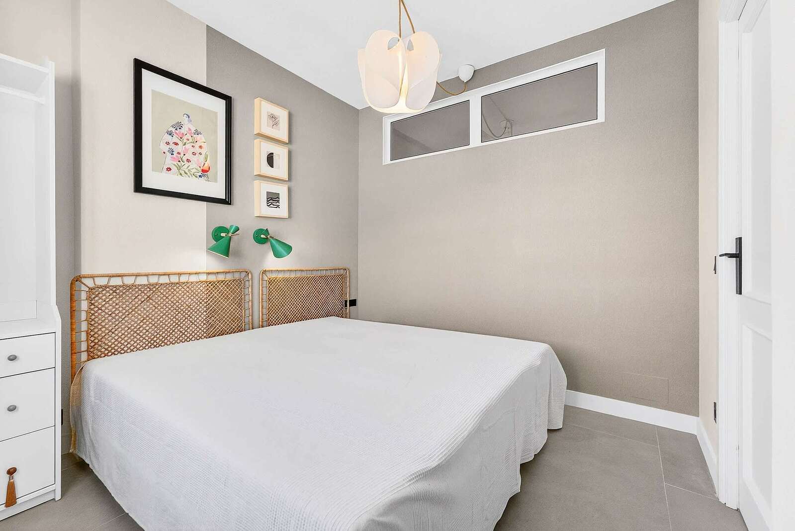 Cozy Bedroom with Rattan Headboard, Designer Lighting & Calm Neutral Tones