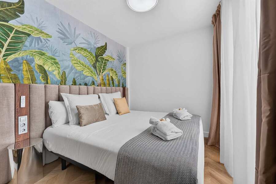 Peaceful Bedroom Retreat with Designer Tropical Accent Wall