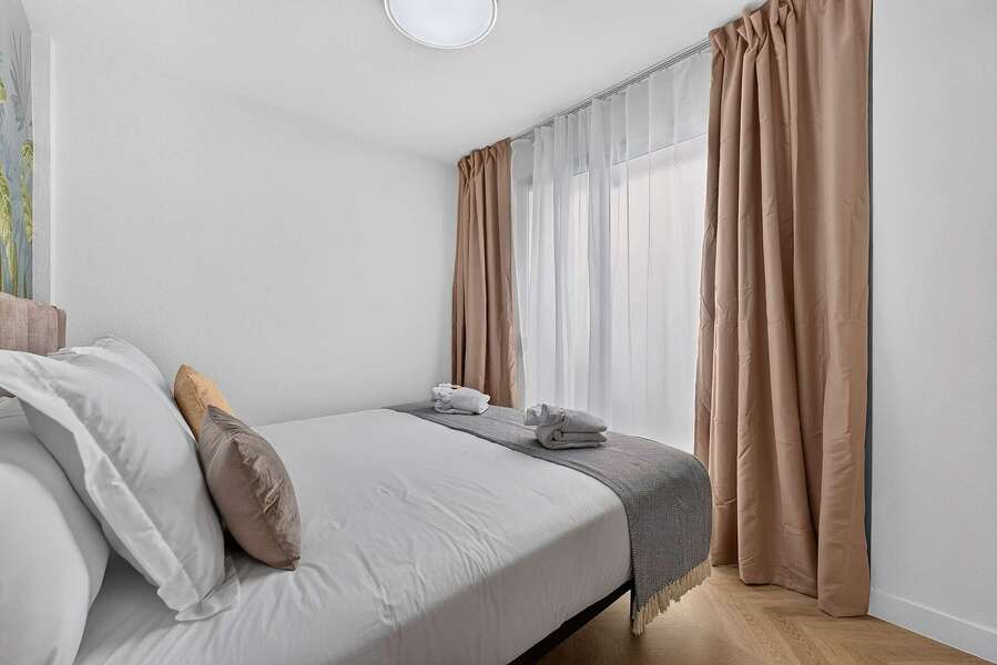 Serene Boutique Bedroom with Sophisticated Island-Inspired Interiors
