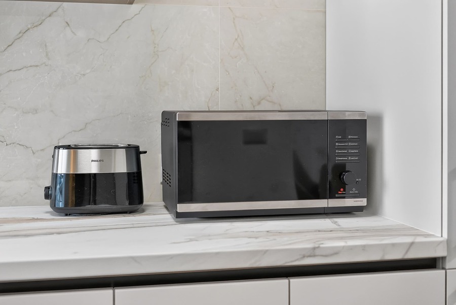 Fully Equipped Kitchen with Toaster and Microwave