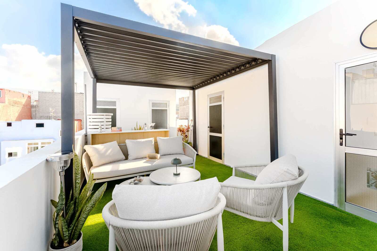 Shared Outdoor Lounge Space with Ocean Breeze and Modern Comfort