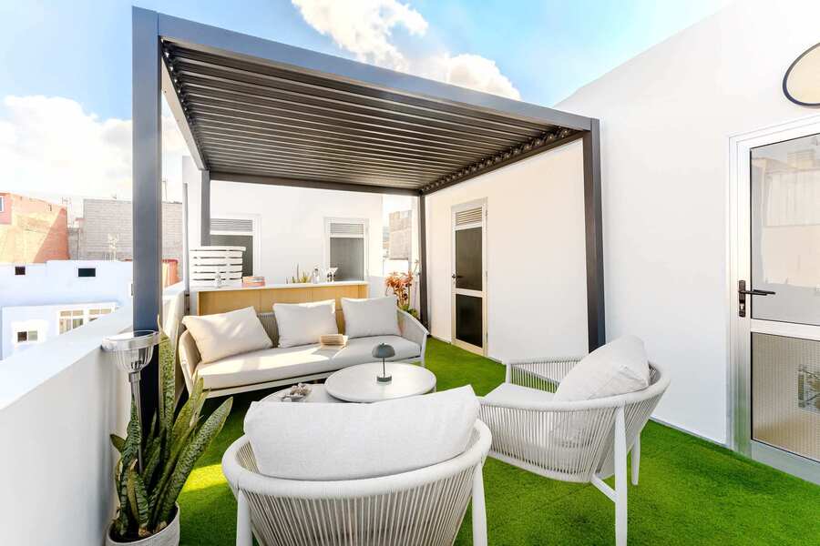 Shared Outdoor Lounge Space with Ocean Breeze and Modern Comfort