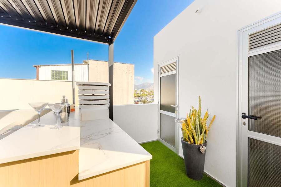 Shared Outdoor Lounge Space with Ocean Breeze and Modern Comfort