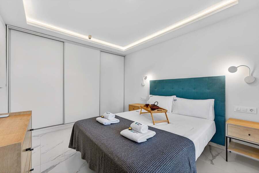 Comfortable Master Bedroom with Large Built-In Wardrobes