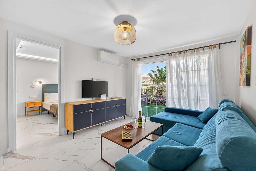 Bright Lounge Area with Smart TV and Direct Terrace Access