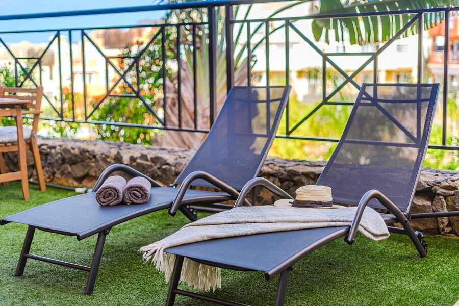 Private Sun Terrace with Comfortable Sun Loungers and Garden Views