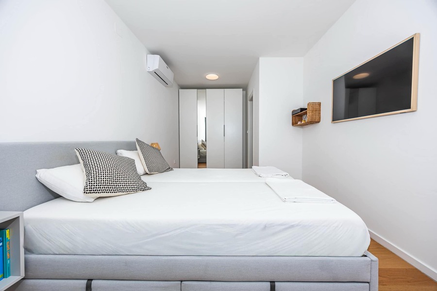 Bedroom 2: queen bed and wardrobe