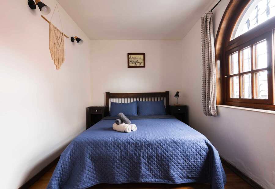 Bedroom with Arched Window