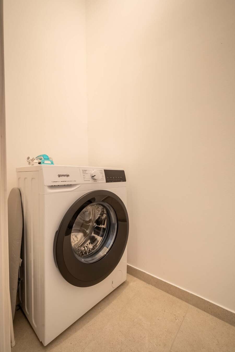 Utility room with washing machine