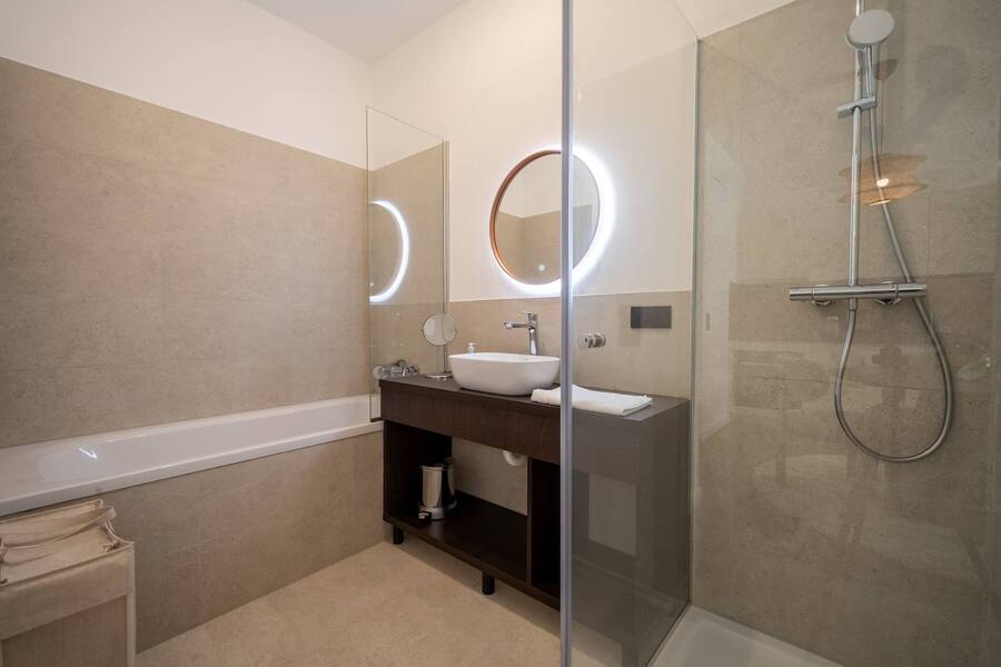 Bathroom with bathtub and walk-in shower