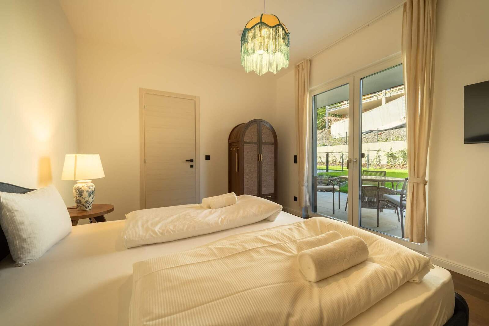 Bedroom 2 with wardrobe and terrace doors