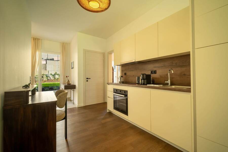 Fully equipped kitchen with a writing desk alongside