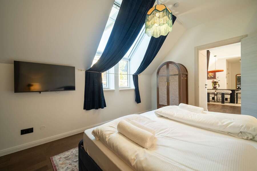Bedroom 1 with TV and wardrobe